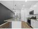 Modern kitchen with granite countertops and white cabinets at 747 Creekway Dr, Fuquay Varina, NC 27526