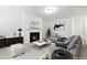 Virtually staged living room with a fireplace and comfy seating at 747 Creekway Dr, Fuquay Varina, NC 27526