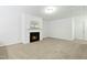 Spacious living room featuring a cozy fireplace at 747 Creekway Dr, Fuquay Varina, NC 27526