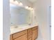 Bathroom with double vanity, large mirror and light fixtures at 76 Brooklynn Trl, Angier, NC 27501
