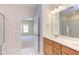 Elegant bathroom with double vanity, large mirror, and walk-in shower at 76 Brooklynn Trl, Angier, NC 27501