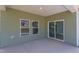 Covered patio with sliding glass door and view of backyard at 76 Brooklynn Trl, Angier, NC 27501