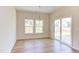 Dining area with hardwood floors, sliding glass doors and chandelier at 76 Brooklynn Trl, Angier, NC 27501