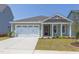 Two-story house with a two-car garage and attractive landscaping at 76 Brooklynn Trl, Angier, NC 27501