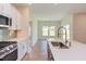 Open concept kitchen with island and stainless steel appliances at 76 Brooklynn Trl, Angier, NC 27501