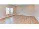 Spacious living room with hardwood floors and large windows at 76 Brooklynn Trl, Angier, NC 27501