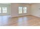 Bright living room featuring hardwood floors and multiple windows at 76 Brooklynn Trl, Angier, NC 27501