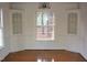 Bright dining room with hardwood floors, built-in cabinets, and large window at 805 Richmond St, Raleigh, NC 27609