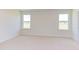 Bright bedroom featuring neutral walls and plush carpeting at 86 Barn Door Dr, Lillington, NC 27546