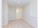 Upstairs hallway with carpet and access to bathroom and bedrooms at 86 Barn Door Dr, Lillington, NC 27546