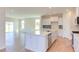 Modern kitchen with white cabinets, quartz countertops, and stainless steel appliances at 86 Barn Door Dr, Lillington, NC 27546