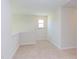 Spacious loft area with carpet and window, ideal for home office or study at 86 Barn Door Dr, Lillington, NC 27546