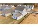 Aerial view showcasing a new home's exterior and landscaping at 86 Brooklynn Trl, Angier, NC 27501