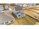 Aerial view of a house with a backyard, next to an empty lot at 86 Brooklynn Trl, Angier, NC 27501