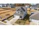 Two-story house with gray siding and a gray roof, in a new development at 86 Brooklynn Trl, Angier, NC 27501
