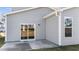 New home's back patio with sliding glass door access at 86 Brooklynn Trl, Angier, NC 27501
