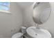 Small half bathroom with white sink, toilet and vanity at 86 Brooklynn Trl, Angier, NC 27501