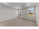 Well-lit bedroom featuring carpet and large windows at 86 Brooklynn Trl, Angier, NC 27501