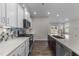 Kitchen features an island, stainless steel appliances, and view to backyard at 86 Brooklynn Trl, Angier, NC 27501