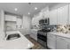 Stainless steel appliances and stylish backsplash in this kitchen at 86 Brooklynn Trl, Angier, NC 27501