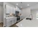 Bright kitchen with stainless steel appliances and white cabinets at 86 Brooklynn Trl, Angier, NC 27501