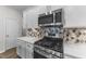 Modern kitchen with stainless steel range and microwave at 86 Brooklynn Trl, Angier, NC 27501