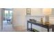 Upper hallway featuring a neutral color palette, console table, and view into a bedroom at 8705 Wardle Ct, Wake Forest, NC 27587