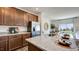 Stylish kitchen with granite countertops, stainless steel appliances, and a view to the bright and open living space at 8712 Wardle Ct, Wake Forest, NC 27587