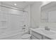 Bathroom with white tub, shower, vanity, and mirror at 8798 Kenridge Ln, Fuquay Varina, NC 27526