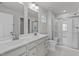 Modern bathroom with double vanity, large shower, and toilet at 8798 Kenridge Ln, Fuquay Varina, NC 27526