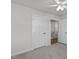 Bedroom with ceiling fan and doors to bathroom and hallway at 8798 Kenridge Ln, Fuquay Varina, NC 27526