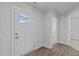 Interior entryway with white door and wood-look flooring at 8798 Kenridge Ln, Fuquay Varina, NC 27526
