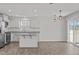 Modern kitchen, granite countertops, and stainless steel appliances at 8798 Kenridge Ln, Fuquay Varina, NC 27526