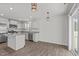 Open concept kitchen with island and stainless steel appliances at 8798 Kenridge Ln, Fuquay Varina, NC 27526