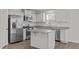 Modern kitchen with stainless steel appliances and granite countertops at 8798 Kenridge Ln, Fuquay Varina, NC 27526