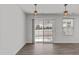 Spacious living room with hardwood floors and sliding glass doors at 8798 Kenridge Ln, Fuquay Varina, NC 27526