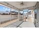 Relaxing screened porch with ceiling fan and backyard access at 8798 Kenridge Ln, Fuquay Varina, NC 27526