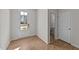 Bright entryway with hardwood floors and view to a half-bath at 88 Railcar Way, Clayton, NC 27520