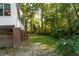 Lush backyard showcasing mature trees providing shade and privacy at 1003 Pagoda Pl, Knightdale, NC 27545