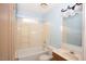 Clean bathroom with shower/tub combo and wood vanity at 1003 Pagoda Pl, Knightdale, NC 27545