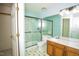 Bathroom with walk-in shower, granite vanity, and wood cabinets at 1003 Pagoda Pl, Knightdale, NC 27545