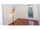 Bright bedroom with hardwood floors, neutral walls, and a window at 1003 Pagoda Pl, Knightdale, NC 27545
