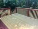 Wooden deck with staircase and railings, offering a serene outdoor space at 1003 Pagoda Pl, Knightdale, NC 27545