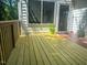 Sunny wooden deck with plants, offering a peaceful outdoor retreat at 1003 Pagoda Pl, Knightdale, NC 27545