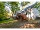Expansive backyard featuring a wooden deck with stairs, ideal for outdoor entertaining at 1003 Pagoda Pl, Knightdale, NC 27545