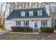 Charming two-story house with a front porch and landscaped yard at 1003 Pagoda Pl, Knightdale, NC 27545