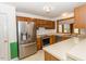 Kitchen with stainless steel appliances and wood cabinets at 1003 Pagoda Pl, Knightdale, NC 27545