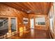 Bright sunroom features wood walls, floors and ceiling; multiple windows and French doors at 1003 Pagoda Pl, Knightdale, NC 27545