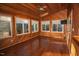 Spacious sunroom boasts wood finishes, large windows, and access to outdoors at 1003 Pagoda Pl, Knightdale, NC 27545