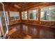 Sunroom with wood walls and floors, skylight, and windows offering natural light at 1003 Pagoda Pl, Knightdale, NC 27545